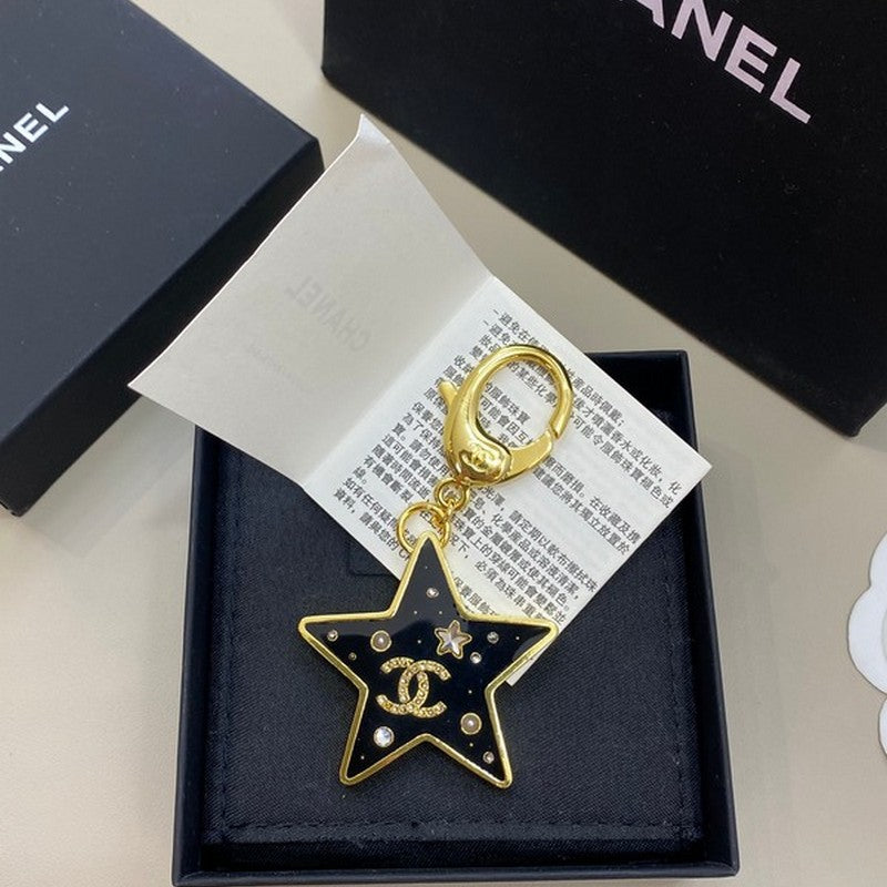 18K  Chanel Black Gold Star Brooch