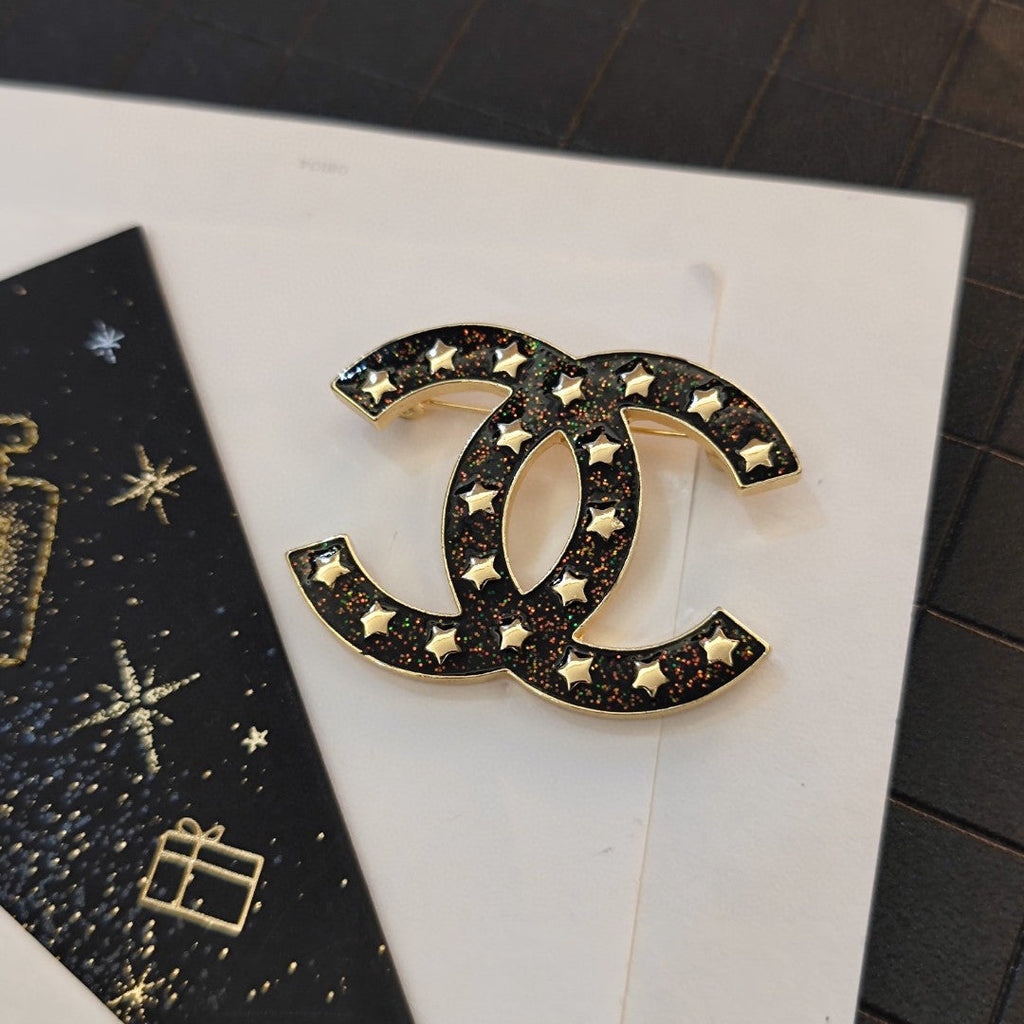 18K  Chanel Black Star Brooch