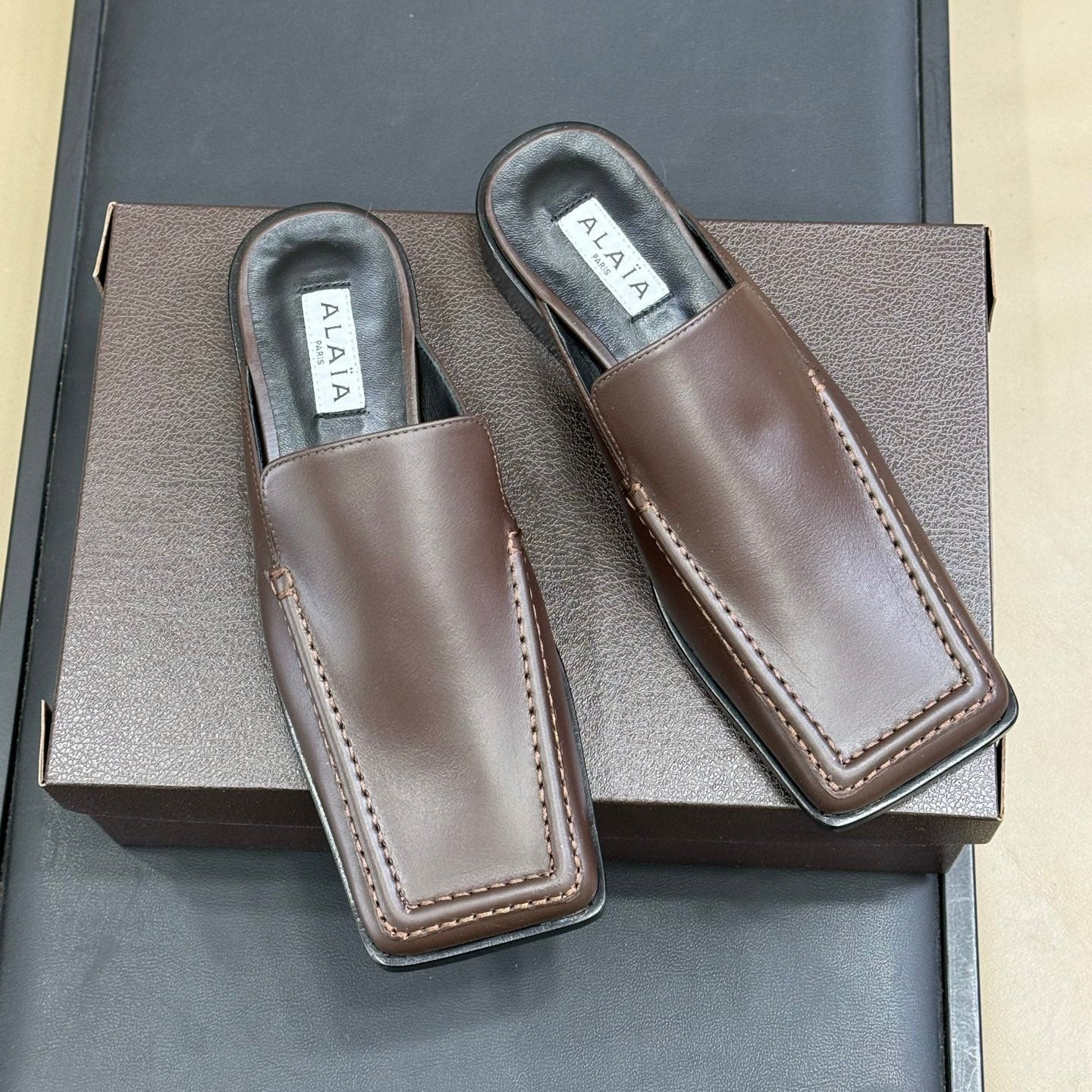 ALAIA 25S SQUARE LOAFER MULES IN BROWN CALFSKIN