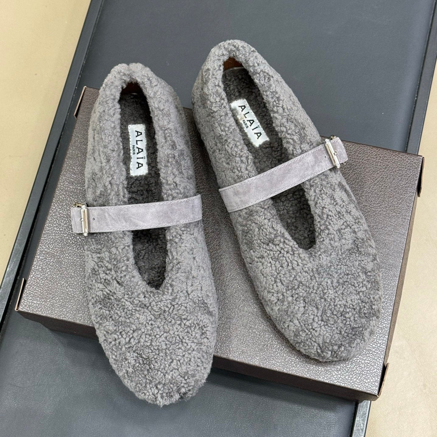 ALAIA 25S COZY MARY JANE SHEARLING FLATS IN DARK GRAY